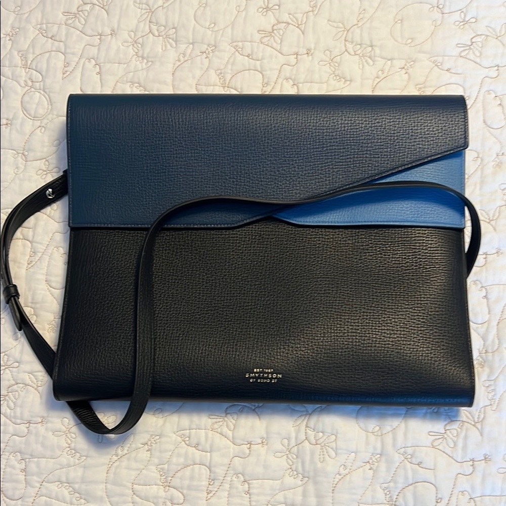 Smythson slim laptop bag. Never used with dust jacket and bag strap.